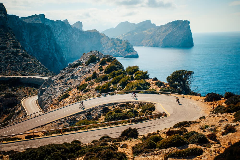 Cap de Formentor: Winding roads and cyclists with cliffs and the ocean in the background