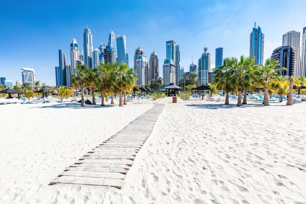 JBR Beach: A white sand beach with boardwalk backing onto the Barceló Residences Dubai Marina