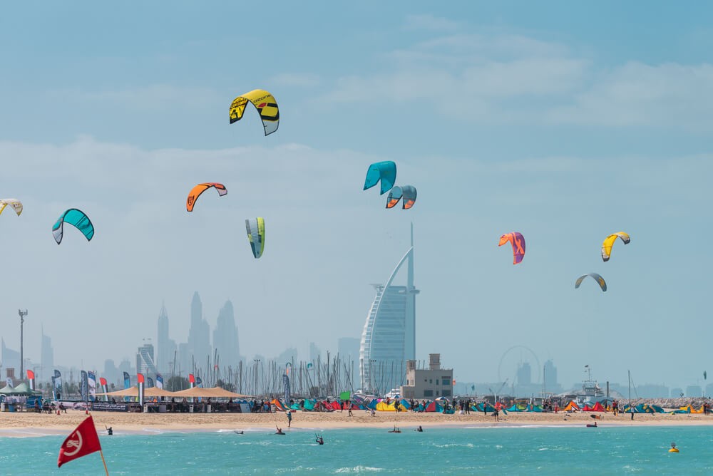 Kite Beach: Golden sand beach with kite surfers enjoying the sea