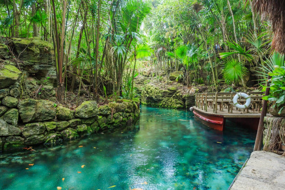 Xcaret Park: A blue lagoon, lazy river surrounded by greenery