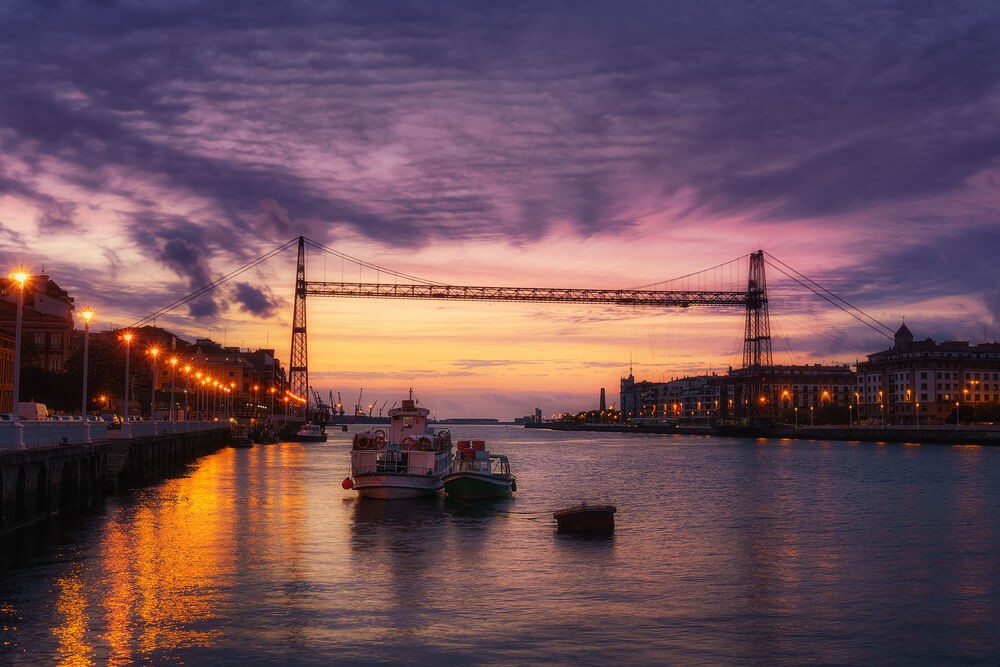 Things to do in Bilbao: The Vizcaya Bridge and the river at sunset