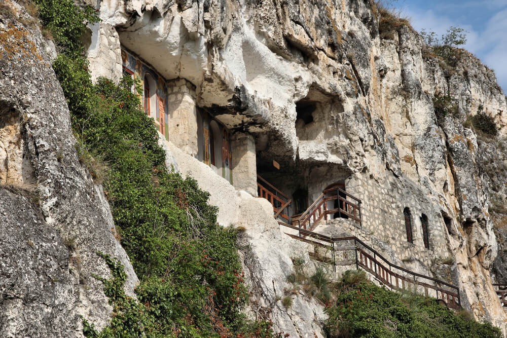 Rock Churches of Ivanovo: A rock face with buildings carved into it