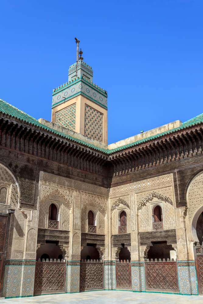 Bou Inania Madrasa: A side-on view of the main patio and tower with mosaic detail