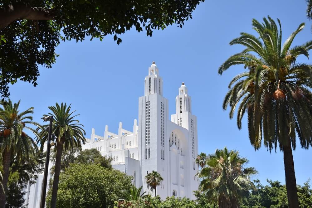 What to do in Casablanca: A view of Casablanca Cathedral from across the palm trees