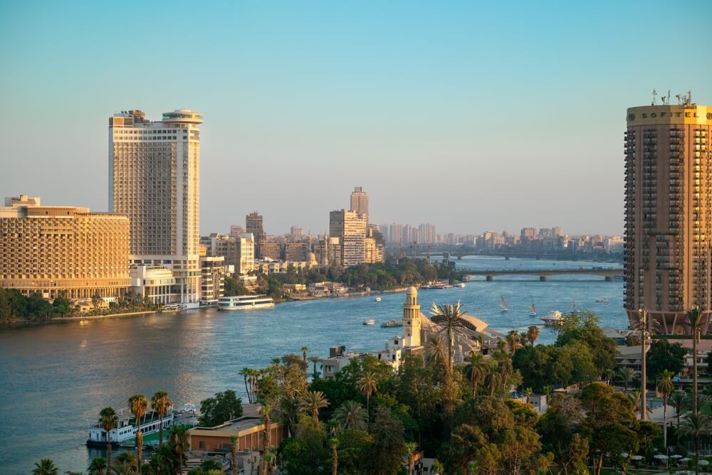 Zamalek: Tall, high rise buildings along the green banks of the river Nile